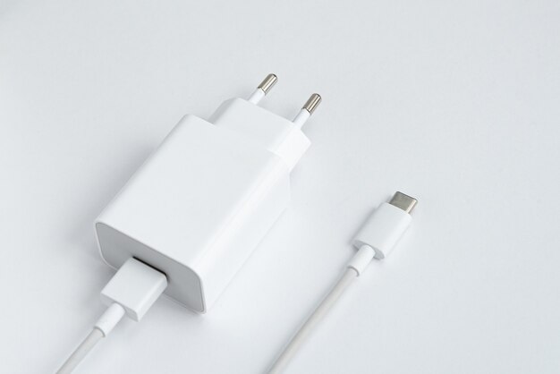 Charger and USB cable type C over white isolated background