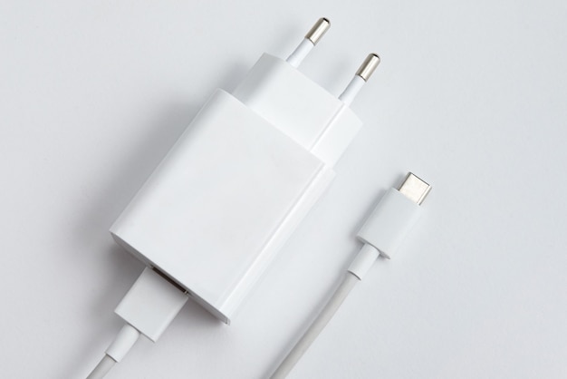 Free photo charger and usb cable type c over white isolated background