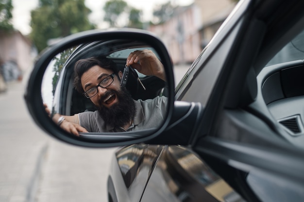 Charismatic man holding car keys