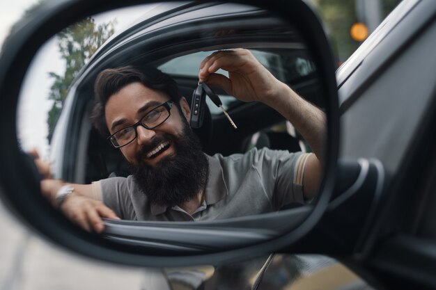 Charismatic man holding car keys