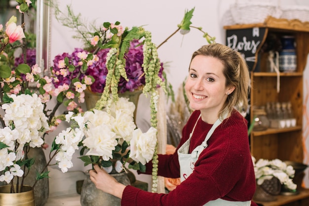 Charming employee of flower shop