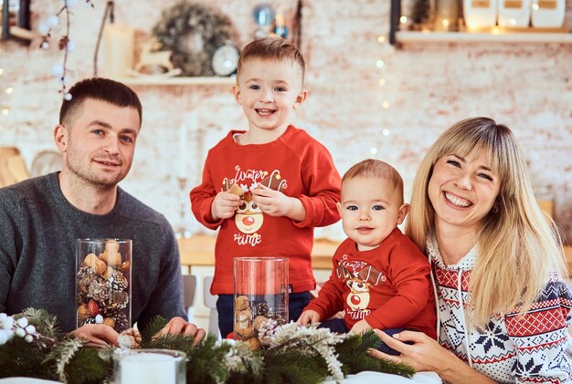 Charming family with sons looking very happy