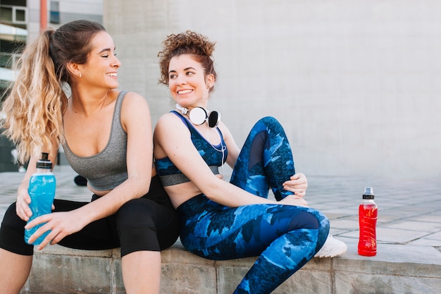 Free Photo charming girls taking rest after workout