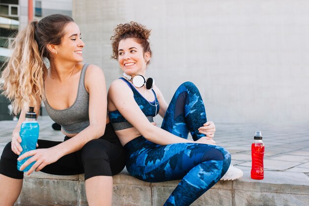 Charming girls taking rest after workout