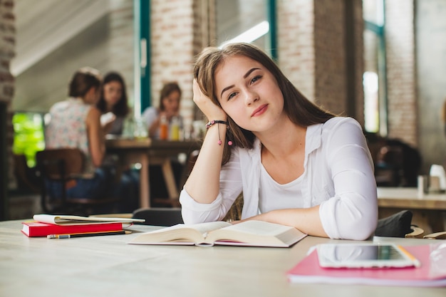 Free photo charming student posing with textbook