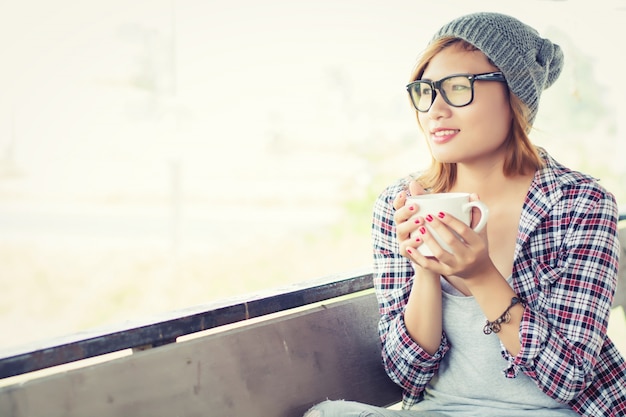 Free photo charming teenager with a cup of coffee