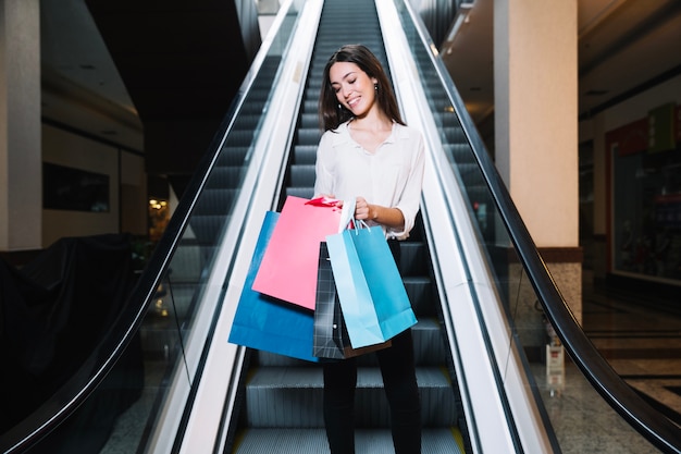 Charming woman enjoying purchases