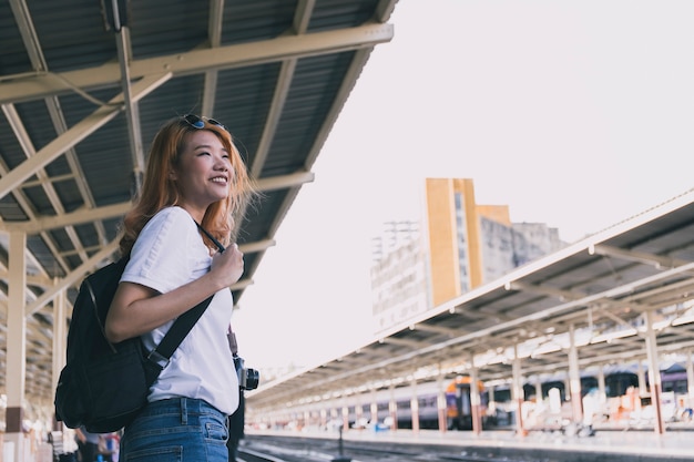 Charming woman laughing on railway roa