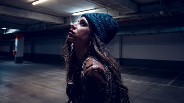 Free Photo charming woman in underground parking lot