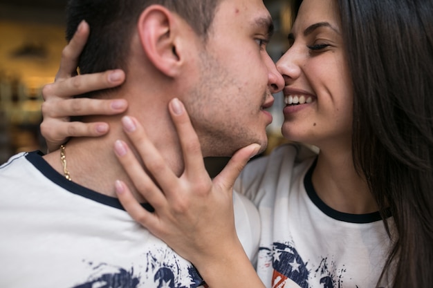 Free photo charming young couple kissing