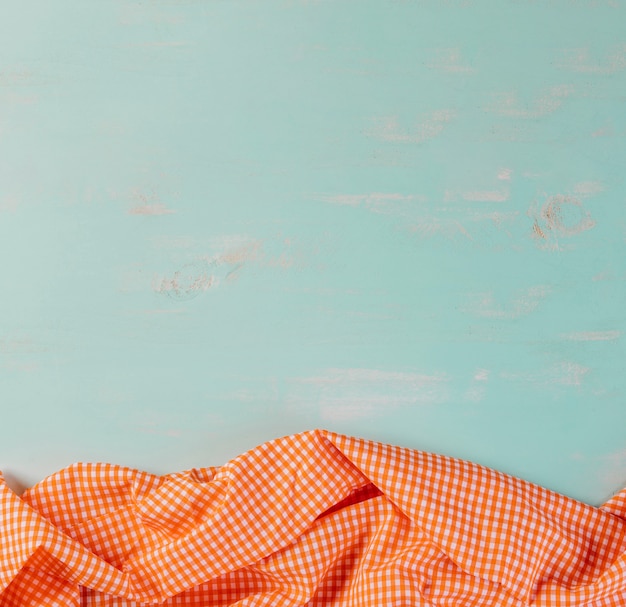 Free photo checkered tablecloth on blue background