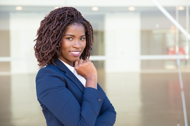 Cheerful African American businesswoman smiling at camera