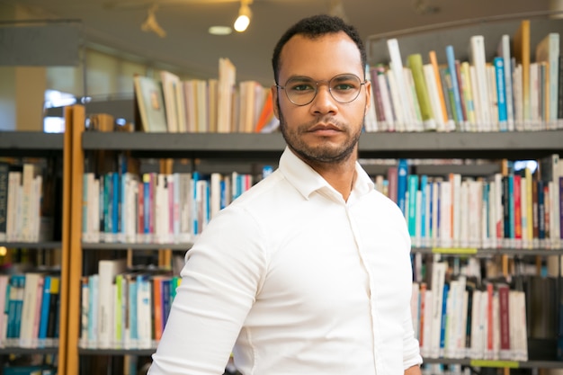 Cheerful black man posing at public library