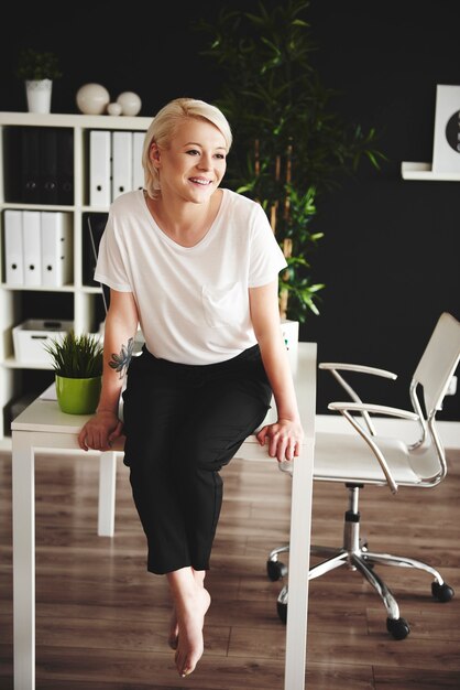 Cheerful businesswoman laughing