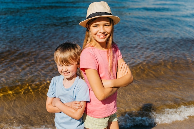 Cheerful children smiling on coast