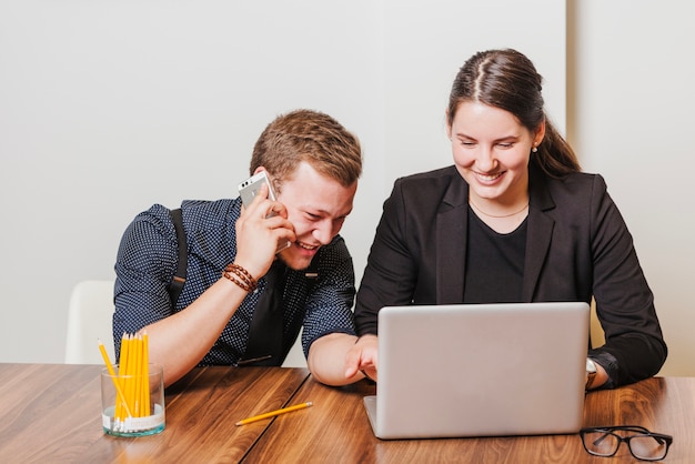 Cheerful colleagues in office