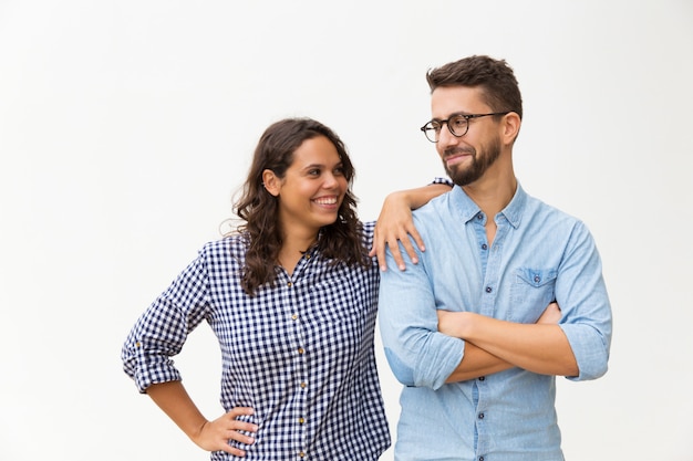 Cheerful couple standing close together