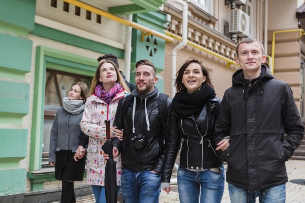 Cheerful couples walking on street