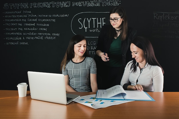 Cheerful female coworkers in office