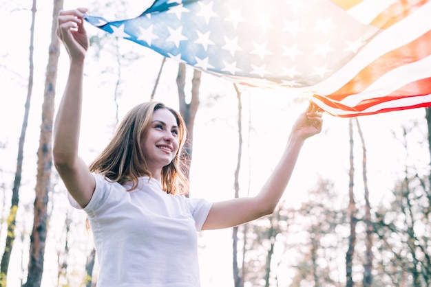 Cheerful female with national American flag