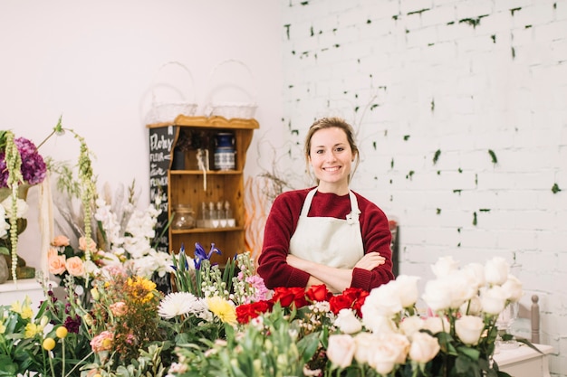 Cheerful florist posing in shop