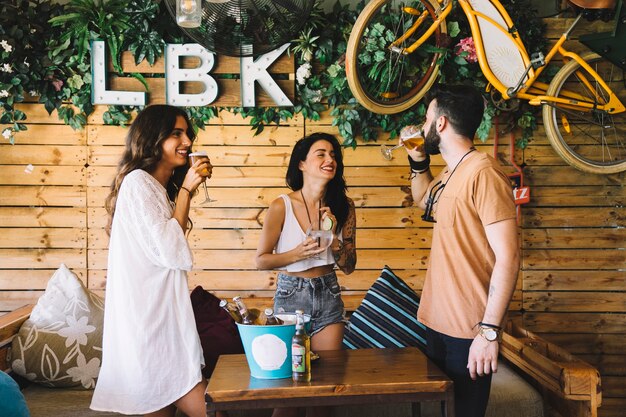 Cheerful friends drinking