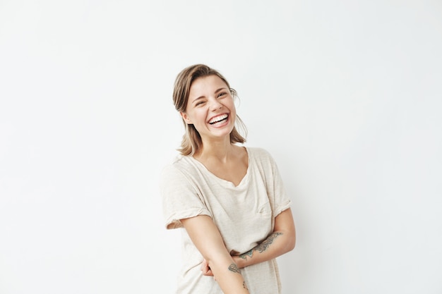 Cheerful happy young beautiful girl smiling laughing .