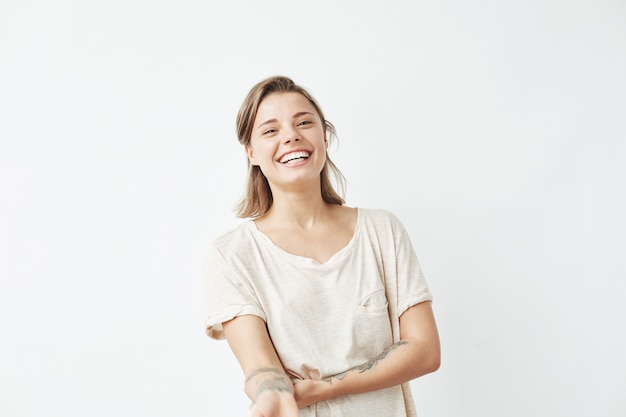 Cheerful happy young beautiful girl smiling laughing .