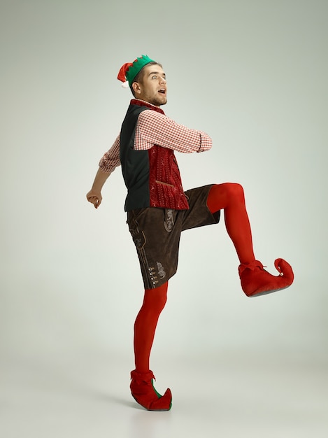 Free Photo cheerful man in elf costume in motion