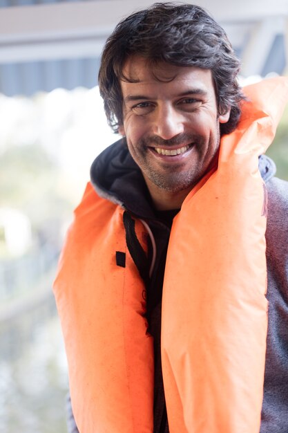 Cheerful man ready to boating trip