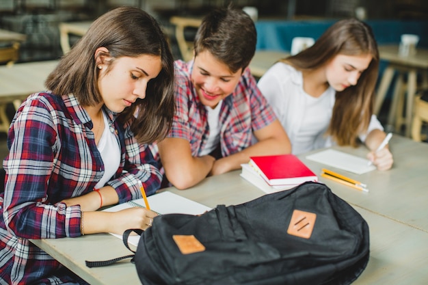 Cheerful man with girls in class room