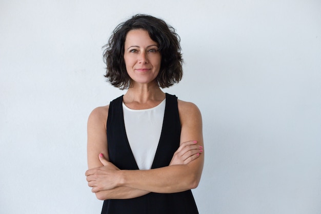 Cheerful middle aged woman with curly hair