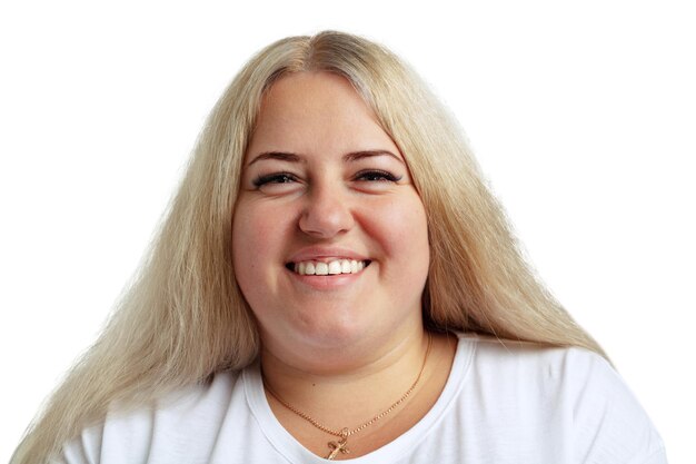 Cheerful, smiling woman with natural skin posing over white background. Weight loss concept