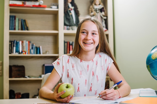 Free photo cheerful student with apple