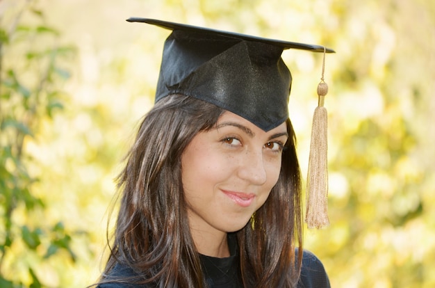 Cheerful student with graduation cap