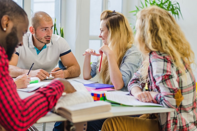 Cheerful students working on new project