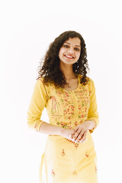 Free Photo cheerful traditional indian woman on white background. studio shot.