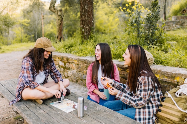 Cheerful travellers at table