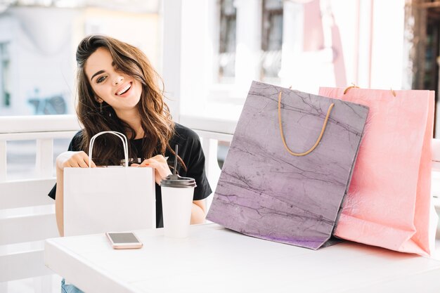 Cheerful woman after shopping