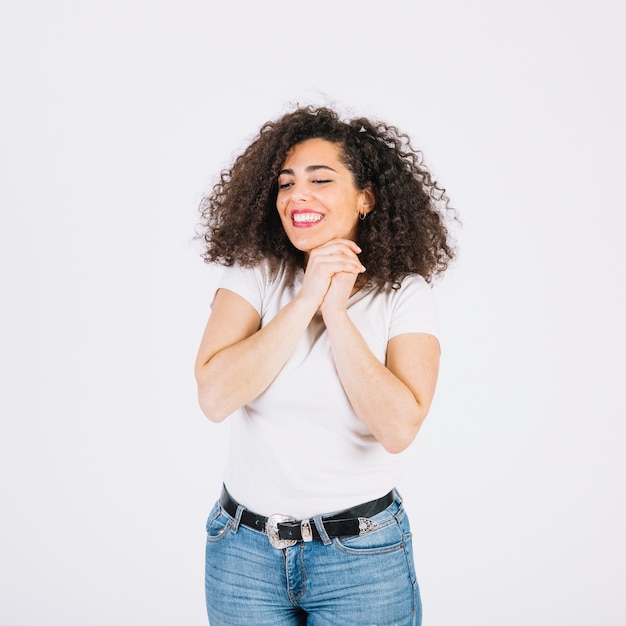 Cheerful woman clasping hands