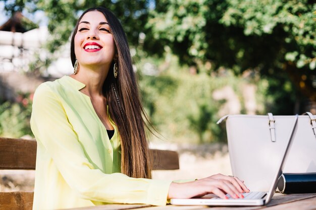 Cheerful woman at laptop