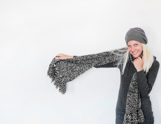 Free Photo cheerful woman showing scarf