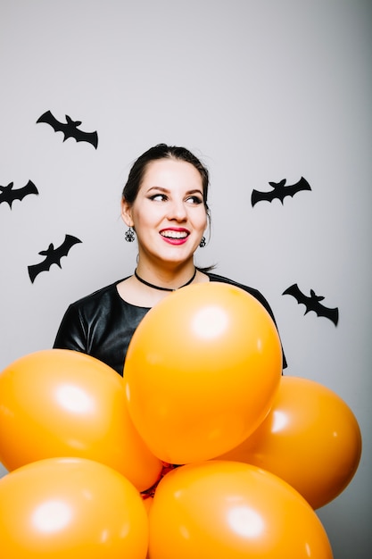 Cheerful woman with Halloween decor