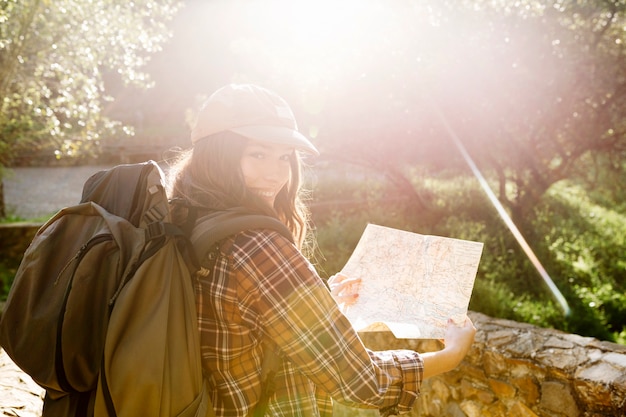 Free Photo cheerful woman with map