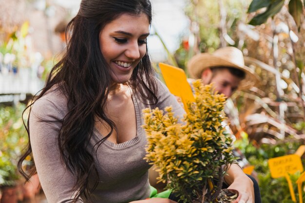 Free photo cheerful woman with yellow flowers