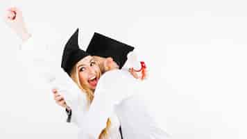 Free photo cheerful young couple celebrating diplomas