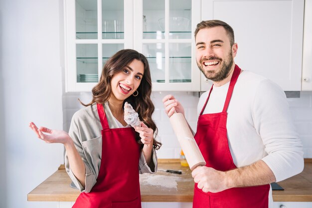 Cheerful young couple on kitchen