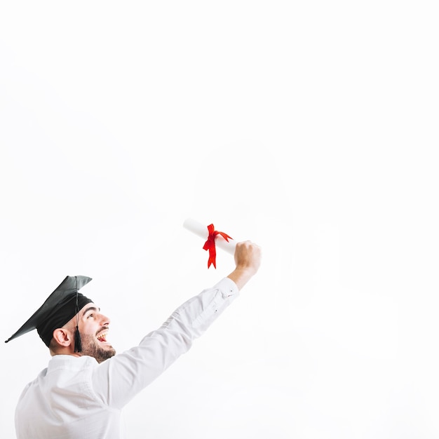 Free photo cheerful young man celebrating with diploma