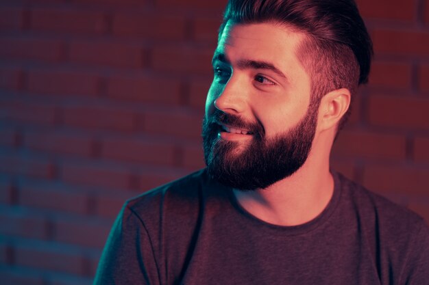 Cheerful young man in a nightclub