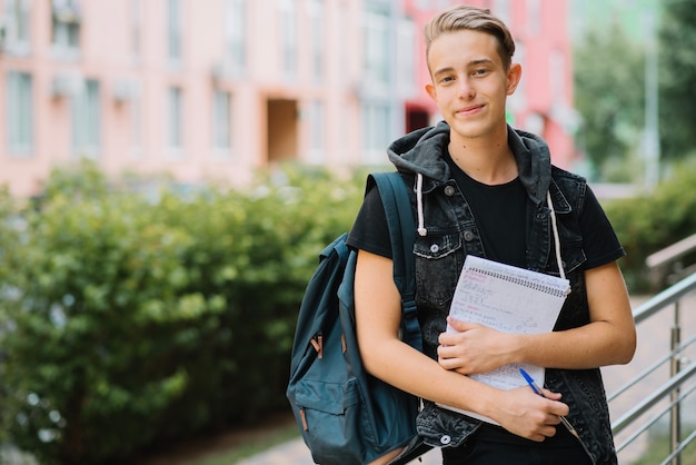 Cheerful young man with studies